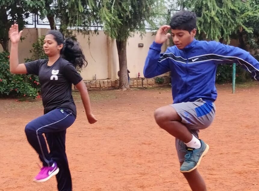 Coach training the child for sports fitness - Rise-Up Program - Advanced Sports Training for Kids (12+ years)