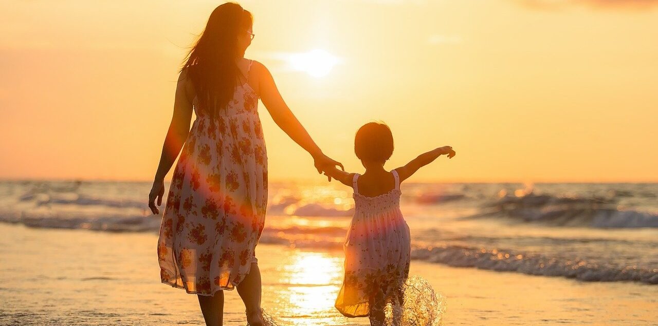 Mother and daughter walking on the beach | Fitness for kids in Bangalore