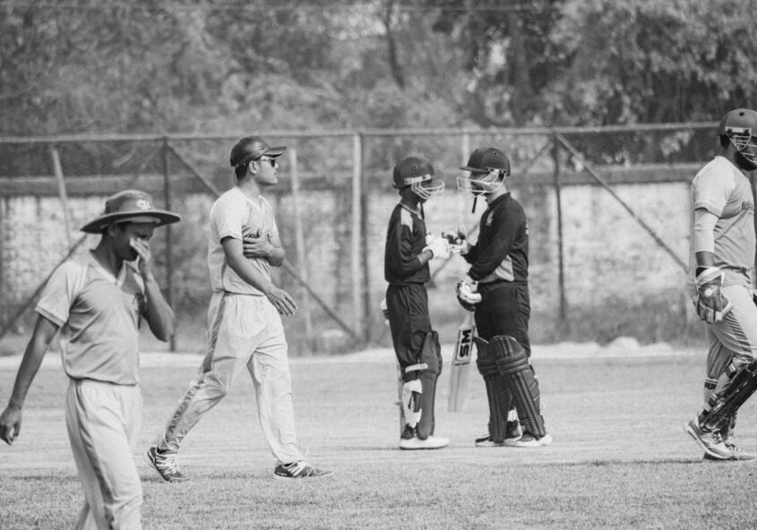 Cricketers playing on a cricket field | sports and fitness for kids in India